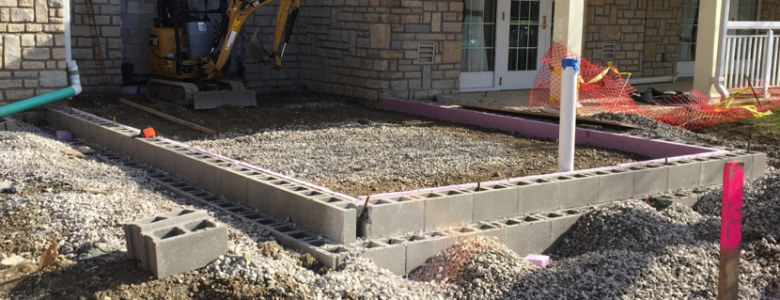 Outside view of future site base of foundation in place