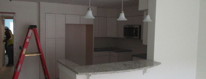 Construction at Riverstone shows ladder in kitchen area