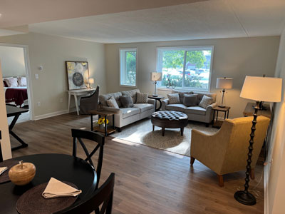 The open-concept dining and living space in The Middleton Independent Living apartment.