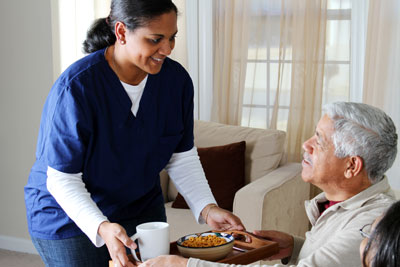 Home health aid with senior man
