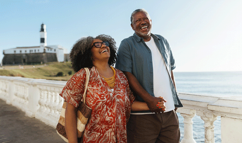 carefree couple strolling on beach