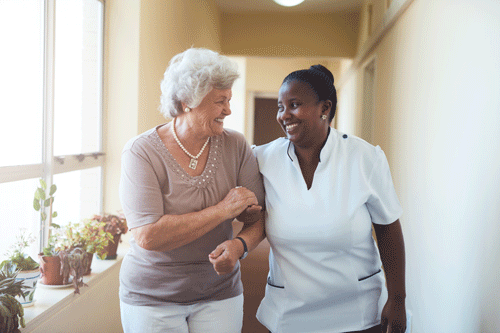 older woman with caregiver at home