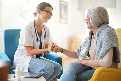 A caregiver visits a member at home