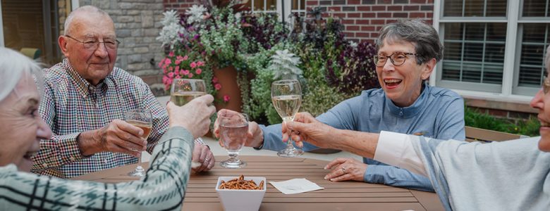Residents toasting one another at Friendship Village of Dublin.