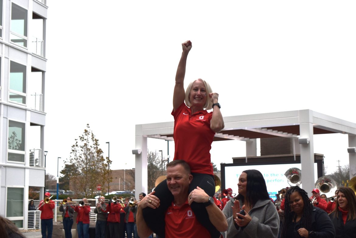 A cheerleader leads the Buckeye Spirit at The Bailey at Bridge Park.