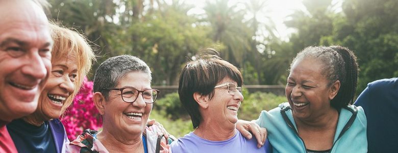 Happy group of multiethnic seniors wearing athletic apparel outdoors.