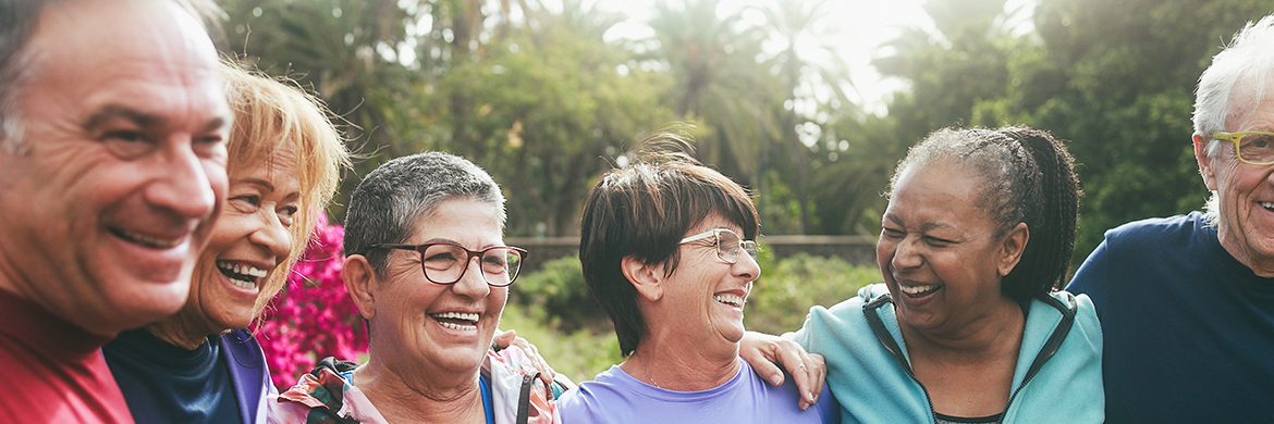 Happy group of multiethnic seniors wearing athletic apparel outdoors.