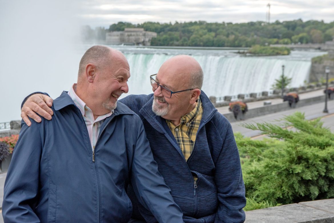 Older male gay couple at Niagara Falls