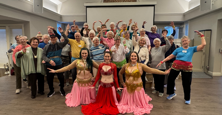 The residents of FVD take a group photo with their trio of local belly dancing instructors, who came to teach the group during Active Aging Week.